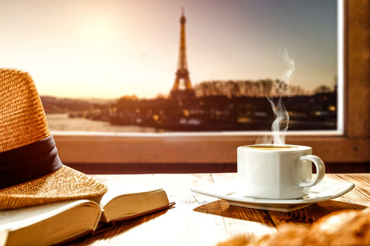 Fresh coffee with croisant and Paris landscape. 
