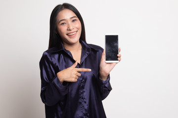 Excited Young Asian woman point to mobile phone.