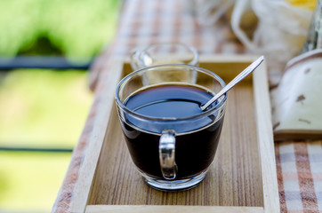 Cup of hot coffee and brown sugar