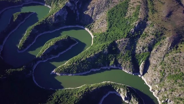 Beautiful Meanders of River Uvac, Serbia on a Sunny Summer Day Aerial View of Incredible Meanders of River Uvac and the surrounding hills, Serbia