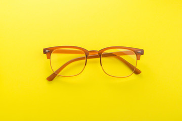 Brown trend glasses on a yellow