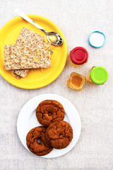 High angle view of healthy breakfast with home baked honey biscuits and toast with honey.