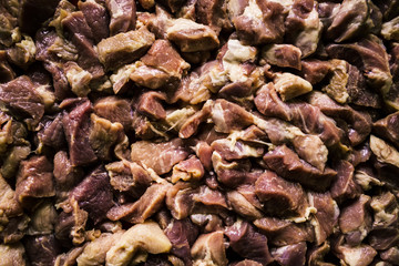 Heap of raw diced beef meat isolated, top view