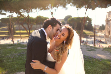 Beautiful wedding couple posing in garden