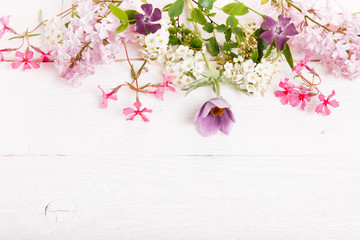 Festive flower composition on the white wooden background. Overhead view