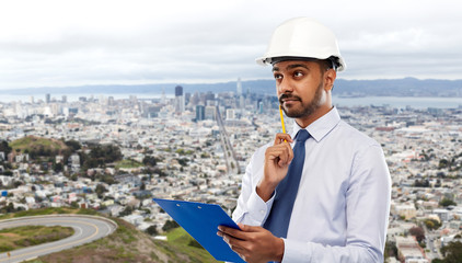 architecture, construction business and building - indian architect or businessman in helmet with...