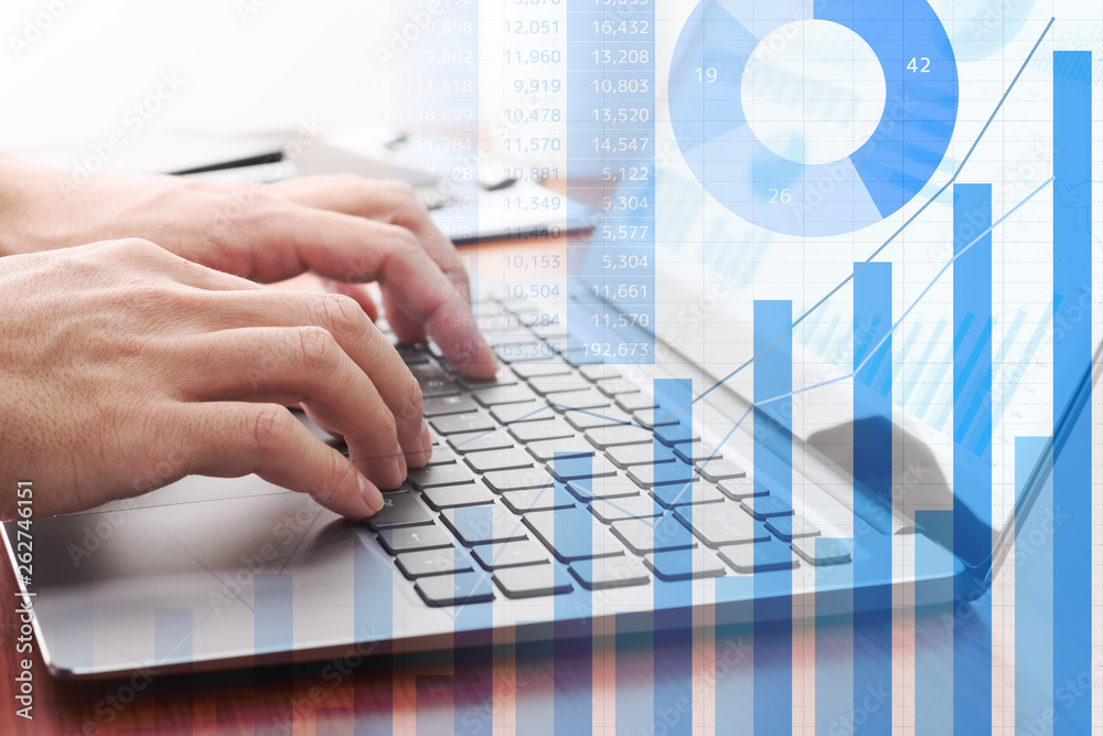 Poster Business analytics concept. Using laptop for calculation.Businessman preparing reports. Many graphs and charts.