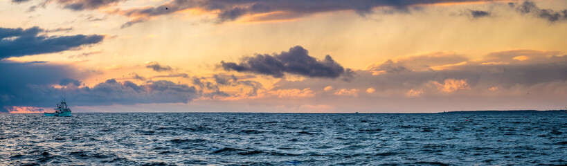 Beautiful Atlantic coastal shoreline scenery of lighthouses and lobster boats.