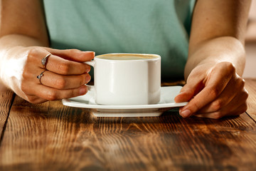 Fototapeta na wymiar Hot coffee and woman hands 