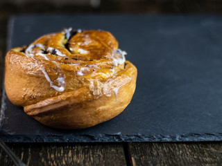 Sweet buns on a dark stone background