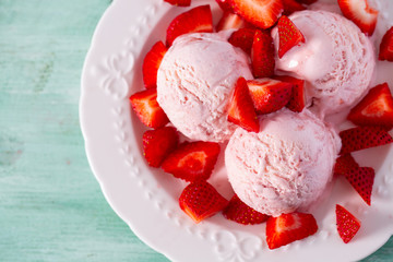 strawberry ice cream on a turquoise surface
