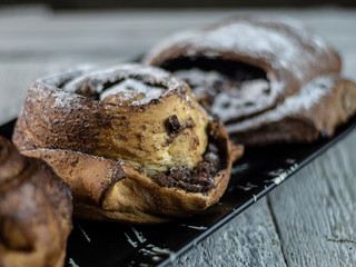 sweet buns on a rough wooden background