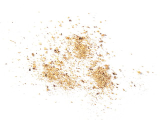 Ground, milled nutmeg powder isolated on white background, top view