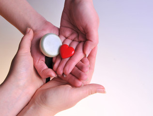 Heart in our hands. The image of the heart in the hands. Healthy lifestyle. Health care. Close-up