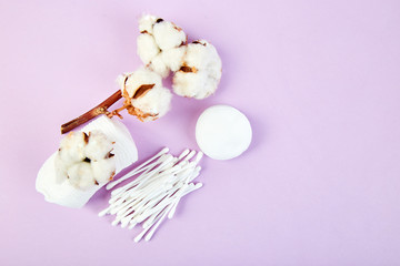 Branch of cotton plant, eared sticks, cotton pads,