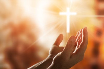 Male hand with cross of lights