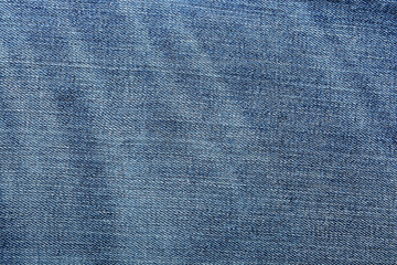 Shabby denim texture for background. Blue jeans 