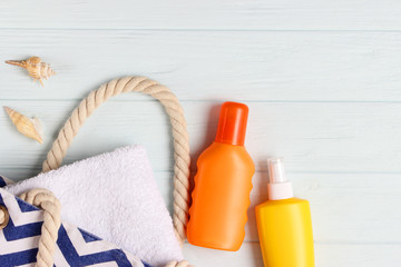  seashells and sunscreen on a colored background top view. Sunscreen