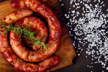 Grilled or Roasted spiral pork sausages with rosemary, salt and peper