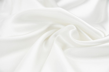 Obraz premium The texture of the satin fabric of white color for the background