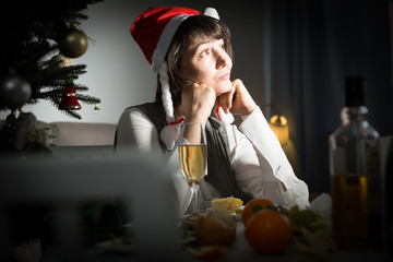 Bored woman watching Christmas tv program