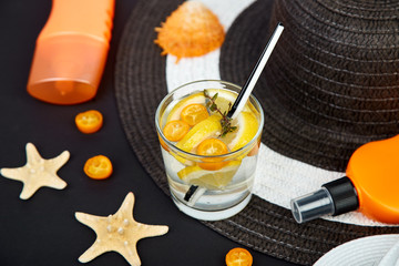 Colorful summer female fashion outfit. Black and white straw hat, flip flops