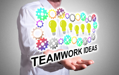 Teamwork idea concept above a human hand