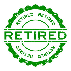 Grunge green retired word round rubber seal stamp on white background