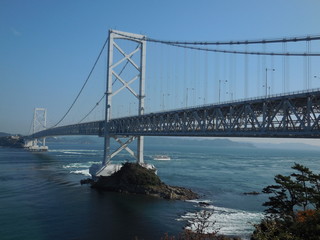 The gorgeous view of blue sea and the white beautiful bridge