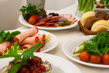 variety of Russian meat and vegetable snacks on the holiday table
