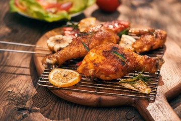 Grilled bbq chicken with fresh herbs and tomatoes