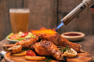 Chef cooking of Crispy Fried Chicken on wooden board background in the restaurants. Foods concept. Warm lights tone.