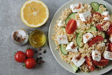 Lebanese salad with bulgur, feta and vegetables. Middle Eastern cuisine.