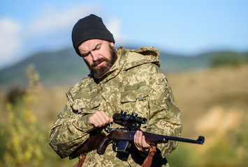 Focus and concentration of experienced hunter. Hunting and trapping seasons. Hunting masculine...