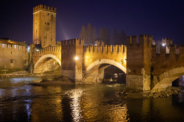 Fototapeta na wymiar Verona, Italy – March 2019. Castelvecchio Bridge, Brick & marble bridge with 3 spans & arches, built in the 14th century & reconstructed after WWII. Verona, Italy, Europe