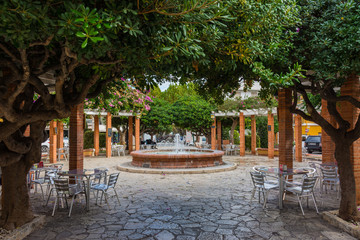 Square and terrace under trees