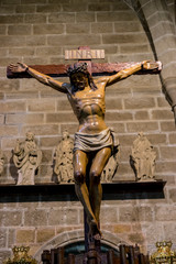 Avila, Spain - April 17, 2019. the crucifixion, religious images of the Holy Week footsteps inside the Cathedral of Ávila, Spain