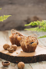 Dellicious homemade nut muffins on table. Sweet pastries