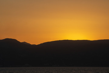 Rock groyne at sunset, Crete, Greece