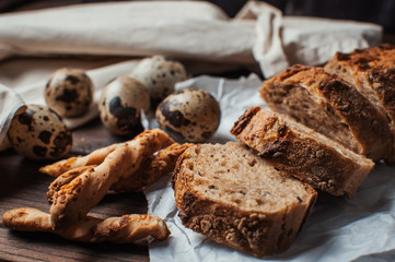 pieces of bread, quail eggs on the table