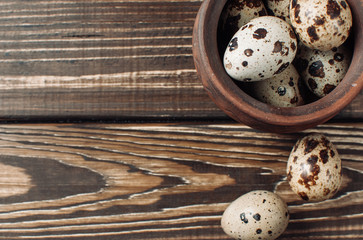 quail eggs on a wooden table with copy-paste