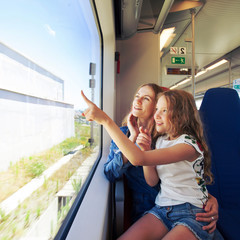 Woman with child traveling by pablic transport