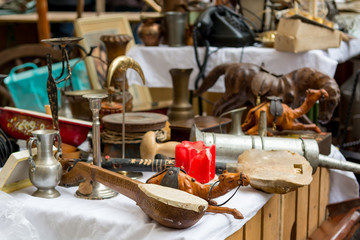Flea market booth with many old items being sold.