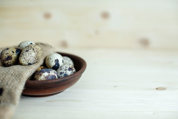 quail eggs on  wooden table top. holy easter. rustic style