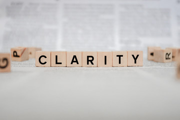 Clarity Word Written In Wooden Cube - Newspaper