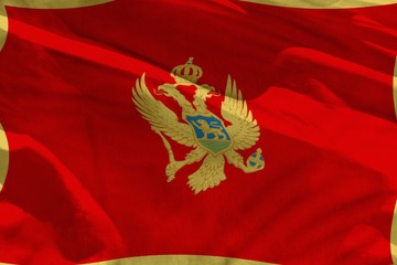 Waving Montenegro flag for using as texture or background, the flag is fluttering on the wind