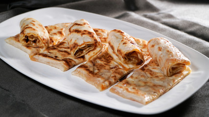 Slices of thin dough stuffed with pumpkin