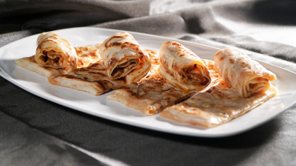 Slices of thin dough stuffed with pumpkin