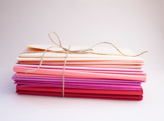 stack of color Tissue paper on white background. concept of decoration, floristics and packaging