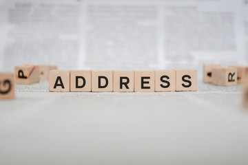 Address Word Written In Wooden Cube - Newspaper